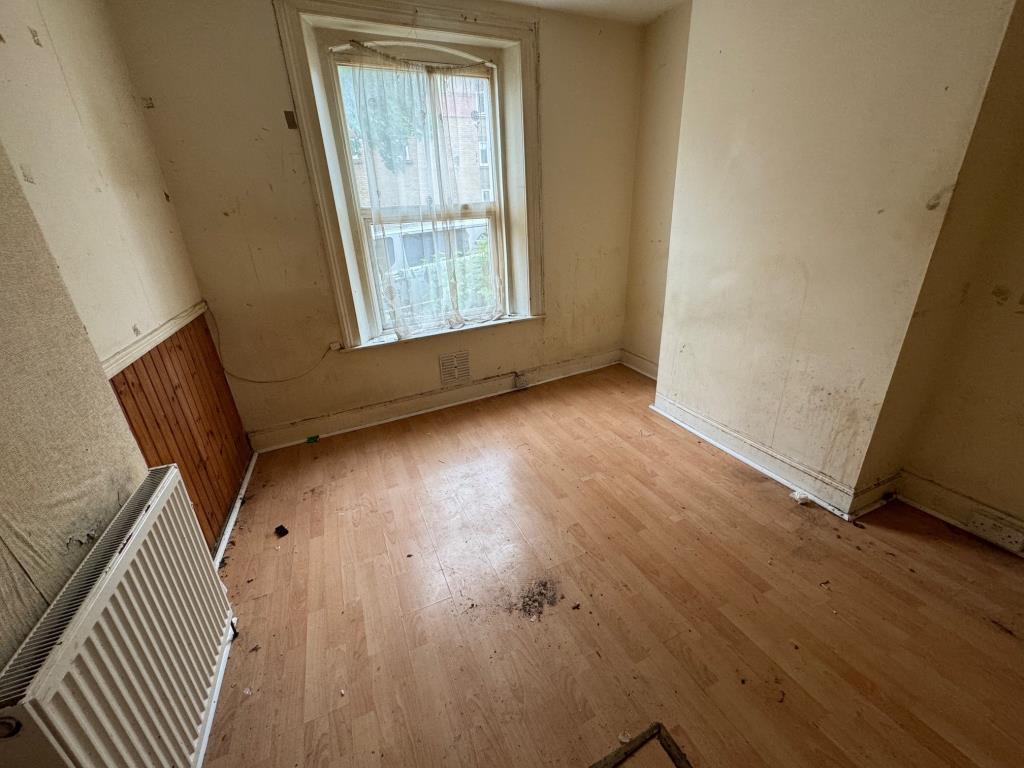 Lot: 53 - FOUR-BEDROOM HOUSE WITH BASEMENT NEAR TOWN CENTRE - Ground floor room to front